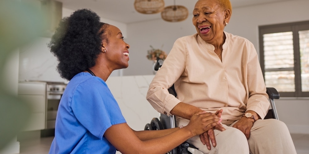 Black,people,,nurse,and,senior,holding,hands,in,wheelchair,,elderly